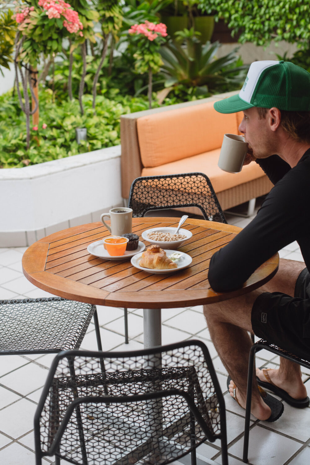 man enjoying outdoor breakfast coffee